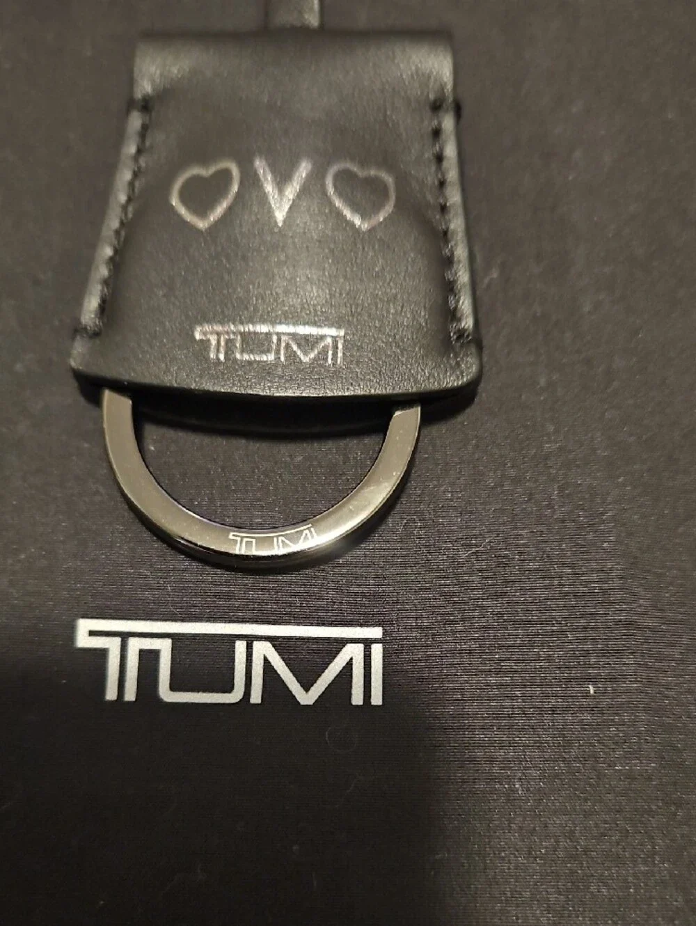 Tumi Black Leather Bag Hook with Heart Accents